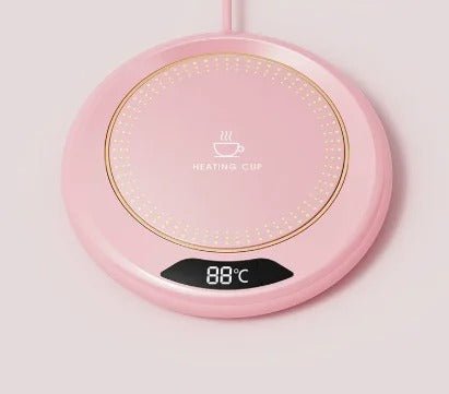 chauffe tasse rose sur fond blanc