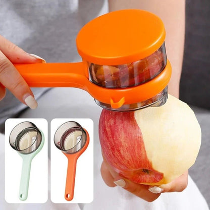 eplucheur-a-legumes-orange-pelant-une-pomme