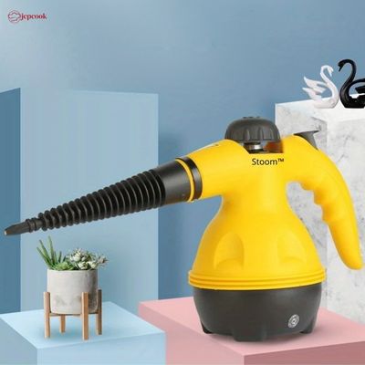 nettoyeur-vapeur-a-main-en-gros-plan-avec-une-plante-a-cote