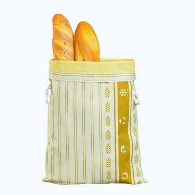 sac à pain vert et marron contenant deux baguettes