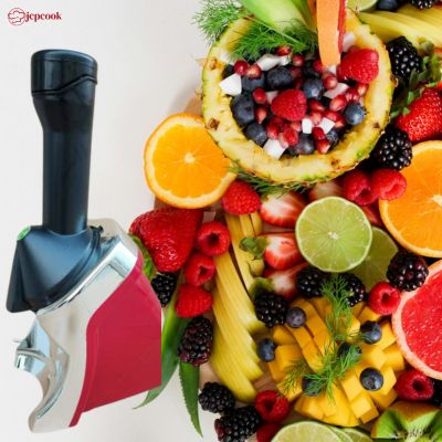 Sorbetière VELOURS FRUITÉ, machine à sorbet noire et rouge près d’un bol de fruits frais colorés et tranches d’agrumes.