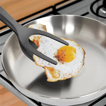 spatule-cuisine-2-en-1-tenant-un-oeuf